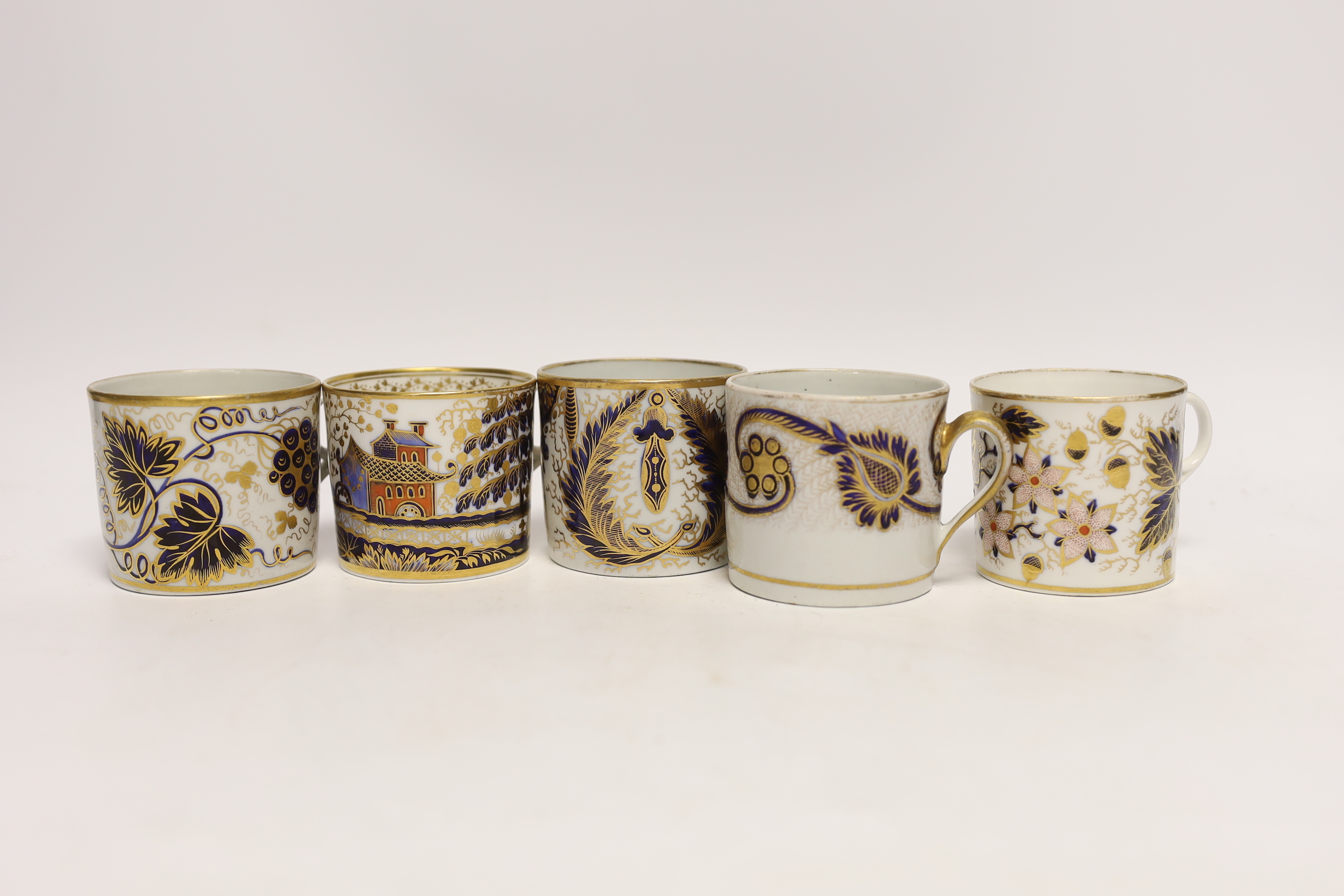 Twelve 1800-1820 English porcelain, mostly blue and gilt decorated coffee cans